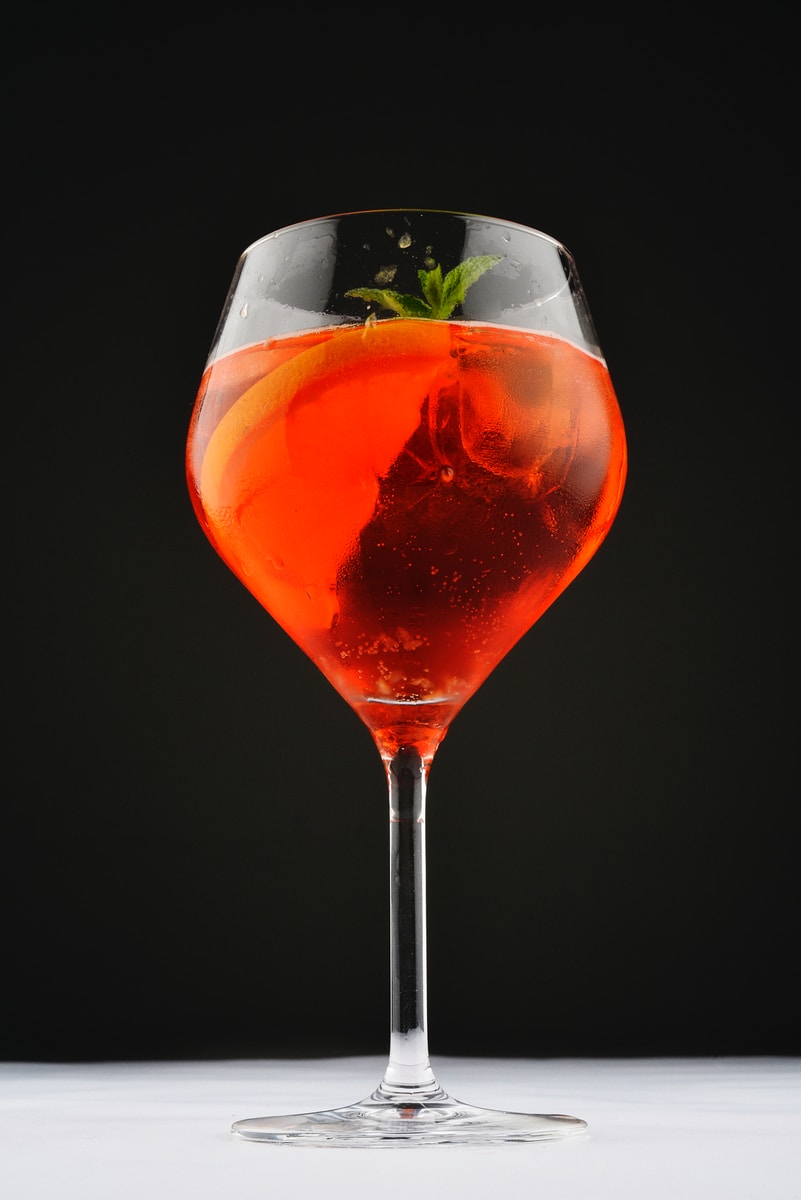 clear wine glass with red liquid
